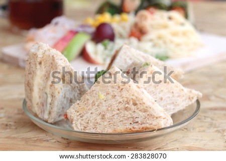 Club sandwich and pasta spaghetti with salad mix fruit