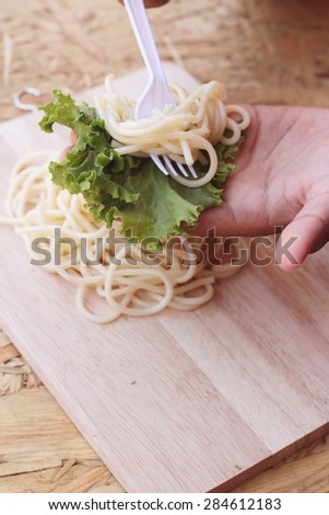 Pasta spaghetti in the hand