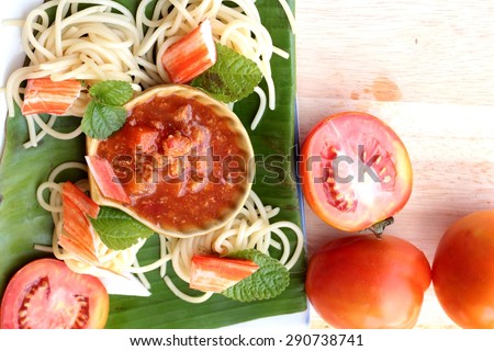 Pasta spaghetti with crab sticks and sauce.