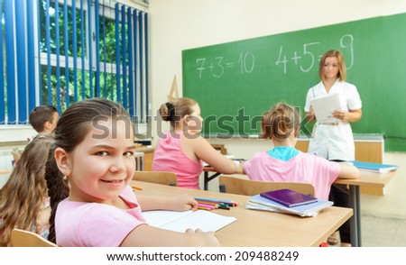 Elementary School Students at Classroom Desks
