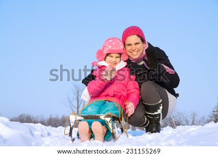 Cute family having fun in the snow