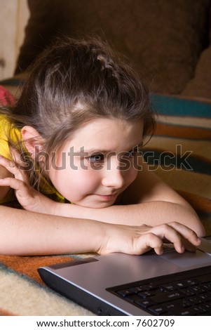 Young girl plays computer games