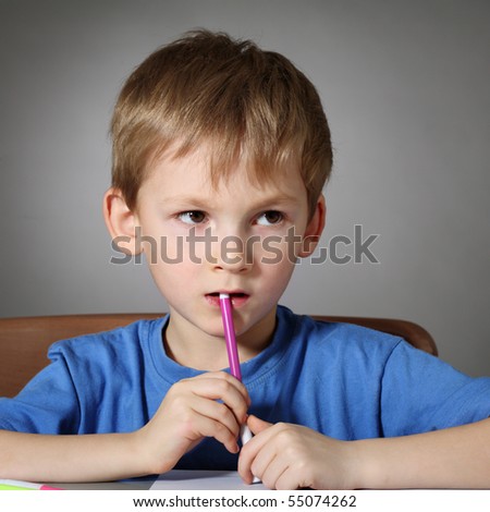 Little boy with felt-tip pen