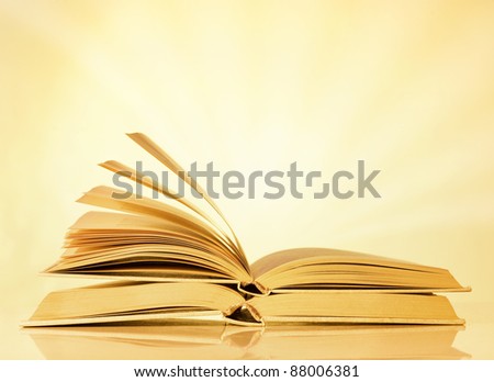 Two books on yellow background