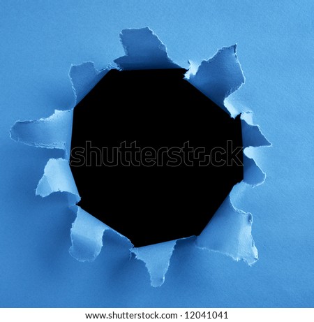 peek through a hole on blue paper