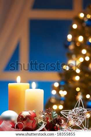christmas decoration with bauble and candle light