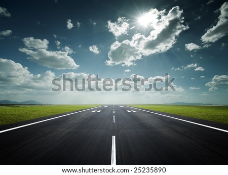 airport runway under the sun as background