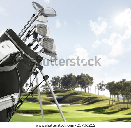close up of golf equipment, course as background