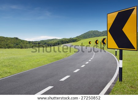 empty curve road with turning left sign