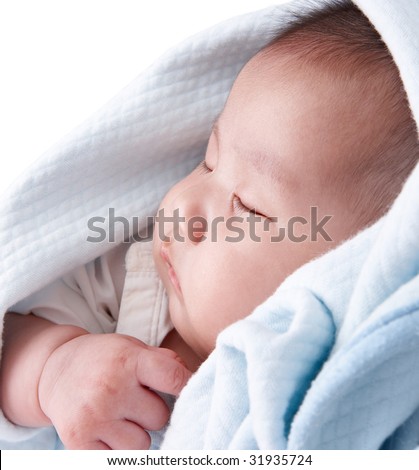 sleeping child in blue blanket having sweet dreams