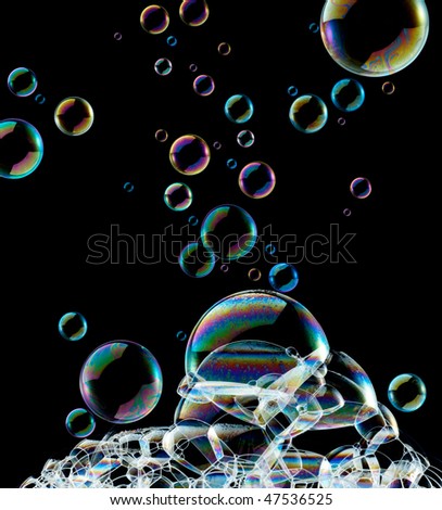 lots of soap bubbles against black background