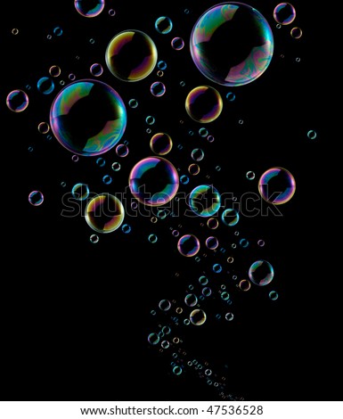 soap bubbles going up from below against black background