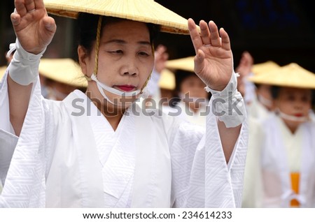 Koya, Japan - June 14, 2011: Elderly Japanese dancer in white traditional clothes during Aoba festival