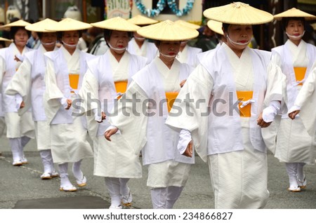 Koya, Japan - June 14, 2011: Elderly Japanese dancers in white traditional clothes during Aoba festival, an annual event celebrating the birthday of Kobo Daishi, a renowned Buddhist saint