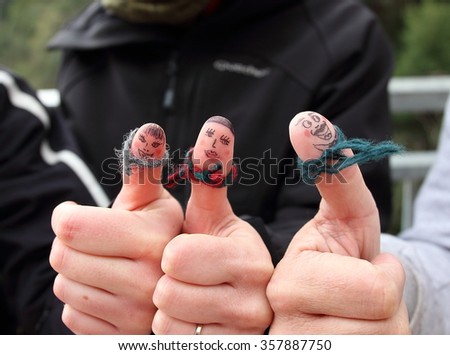 A group of friendly face painted fingers that go out to the mountain together.