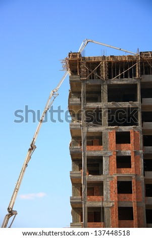construction of building with cement mixture machine