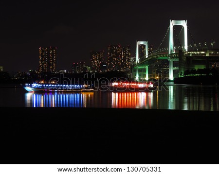 Tokyo Bay at night, with fancy boats on water