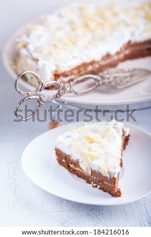 A slice of carrot cake, gluten-free, flour from rice, flax. Selective focus.