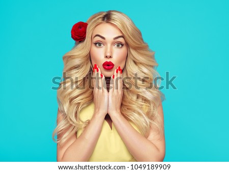 Beauty woman emotion with long curly blonde hair and flower in hair manicured nails beautiful girl summer trendy colors blue and yellow