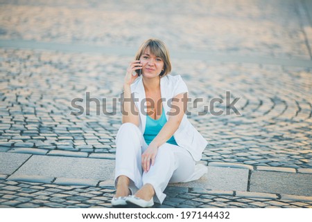 woman talks telephone