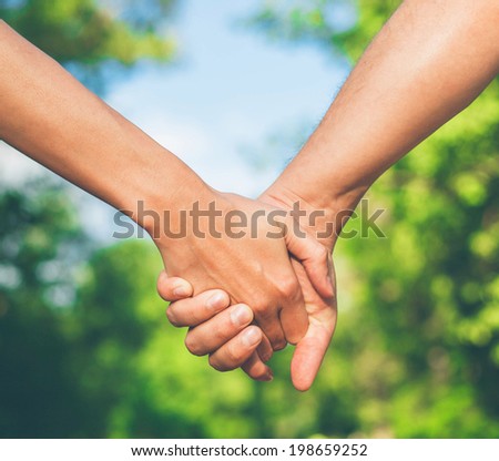 hold each other\'s hand two hands together
