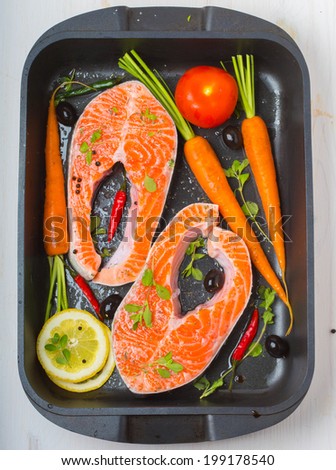 salmon fish with vegetables and lemon and herbs