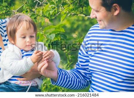 baby with father in the garden
