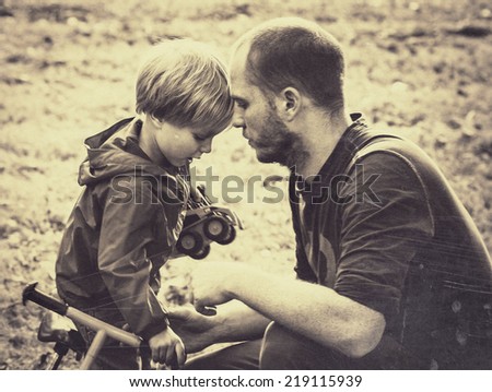 family father with son black and white