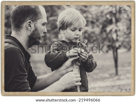 family in park, black and white father with son