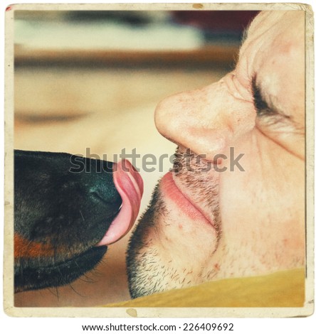 dog lick face of man