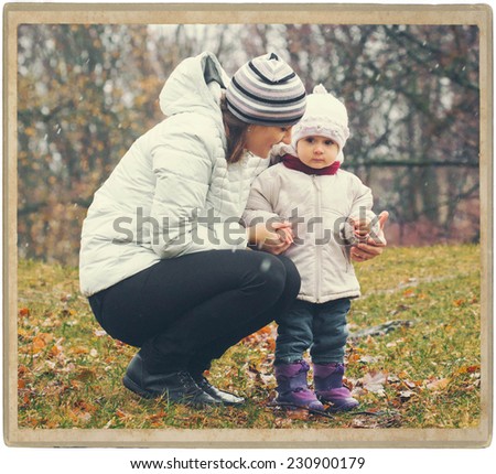 Family Mother and Child in Park Nature in Same clothes