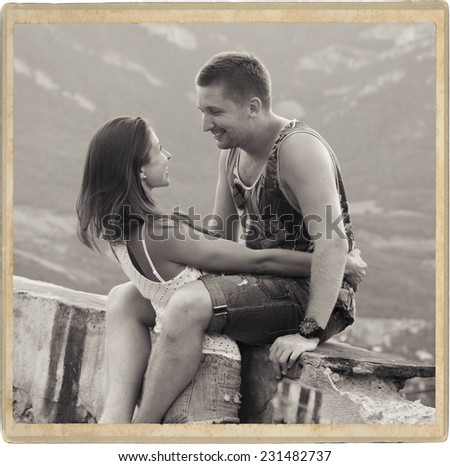 Young beauitiful couple in love summer time nature black and white vintage card
