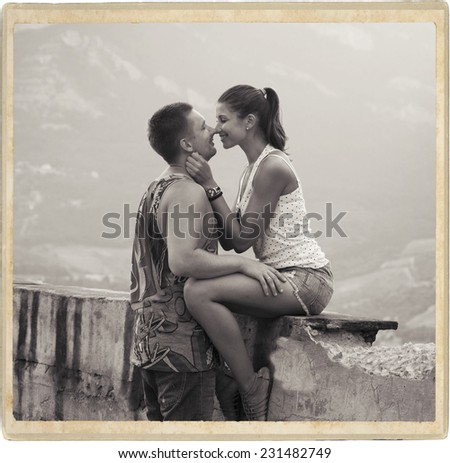 Young beauitiful couple in love summer time nature black and white vintage card