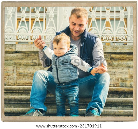 family parents with child in the park walking and playing  in same jeans clothes father with son