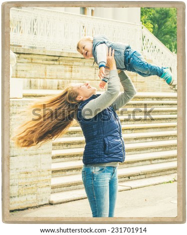 family parents with child in the park walking and playing  in same jeans clothes