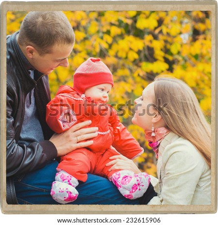Family  parent with child in park in autumn walking
