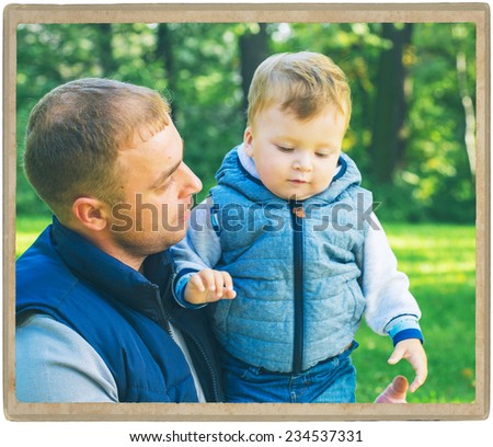 Family father  with child in park walking in same clothes textile jeans jacket