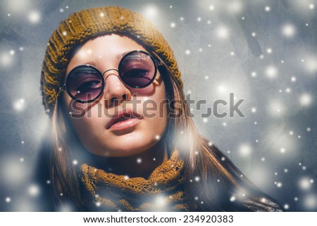 New Year snow holiday young beautiful hipster woman portrait in glasses and knitted clothes