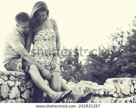 couple in love together summer time outdoors black and white