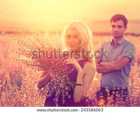 beautiful landscape and couple in love with flowers on sunset happy people outdoor