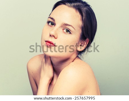 Portrait of fun attractive girl woman with freckles clear skin and beautiful hair