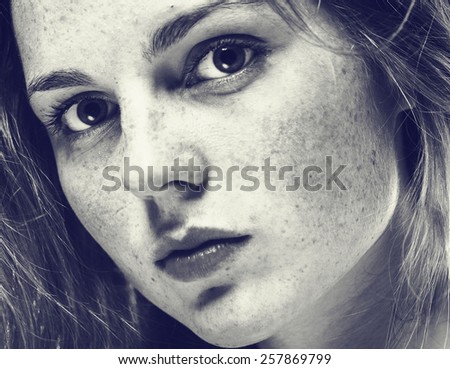 Portrait of fun attractive girl woman with freckles clear skin and beautiful hair black and white