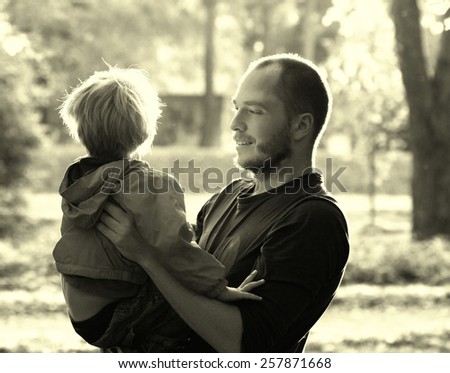 Family together with child nature Father with son playing vintage black and white