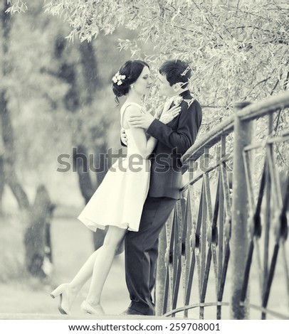Couple in love together outdoors happy wedding groom and bride nature black and white