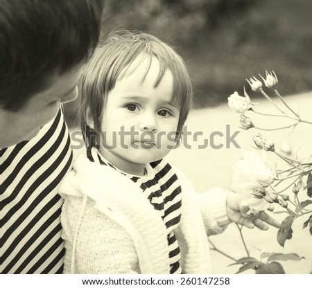 Family with child father  in same stripes clothes vintage black and white nature