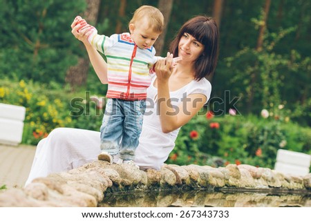 Family mother with child happy outdoors summer time