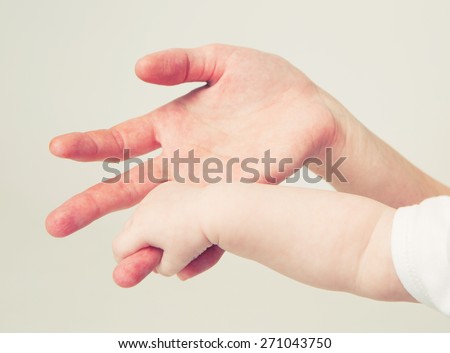 Mother hand baby hand care love family