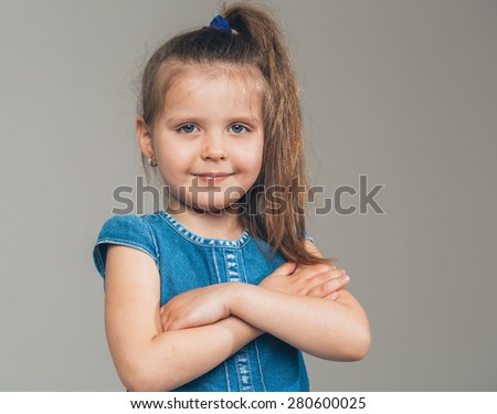 Little cute girl portrait cross hands