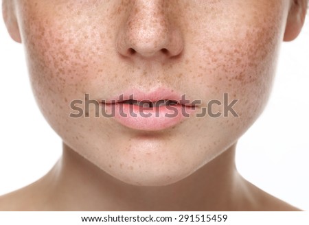 Woman bite lips close up face beautiful