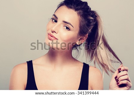 Beautiful young woman portrait smiling posing attractive blond